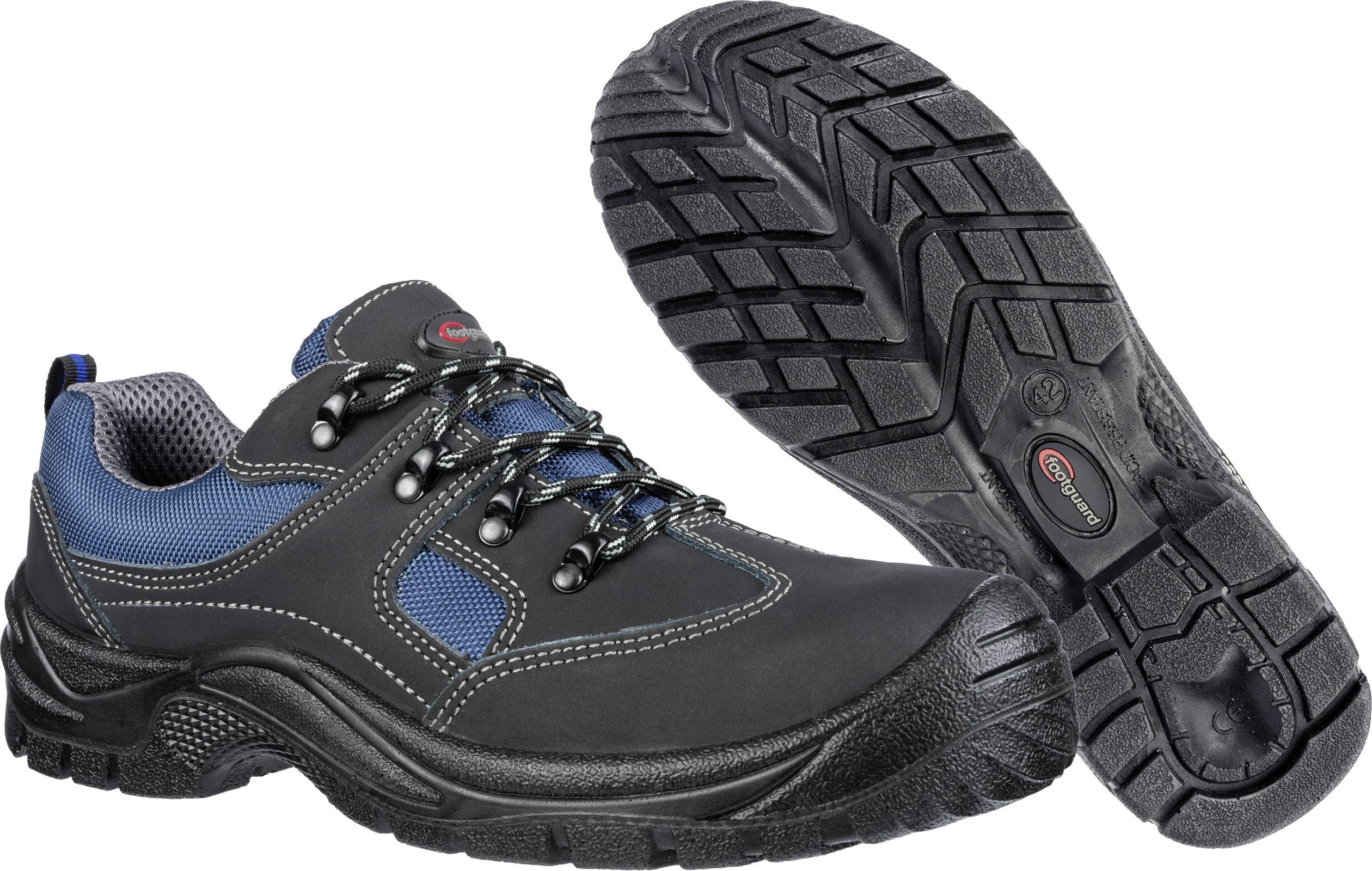 A pair of black safety shoes with blue details and non-slip sole. Ideal for workplace protection and robust environments.