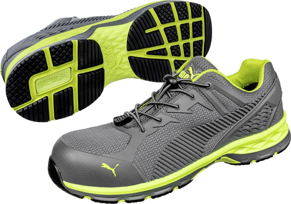 Grey and yellow-green sports trainers with breathable material and a stable sole, showing the front and underside of the shoe.