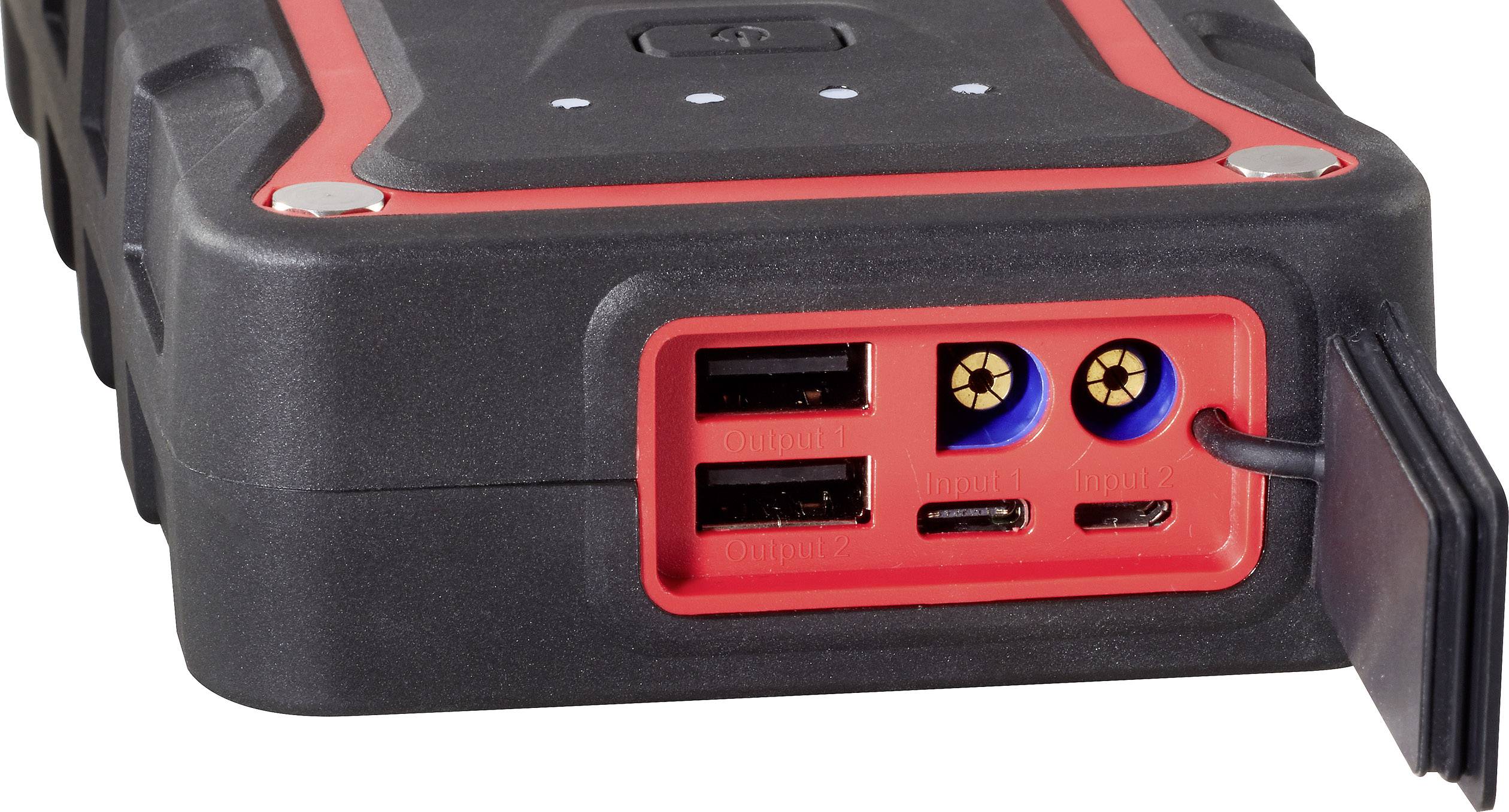 A portable battery emergency charger with two USB ports, a DC output, and a sealed rubber section for cable connections.