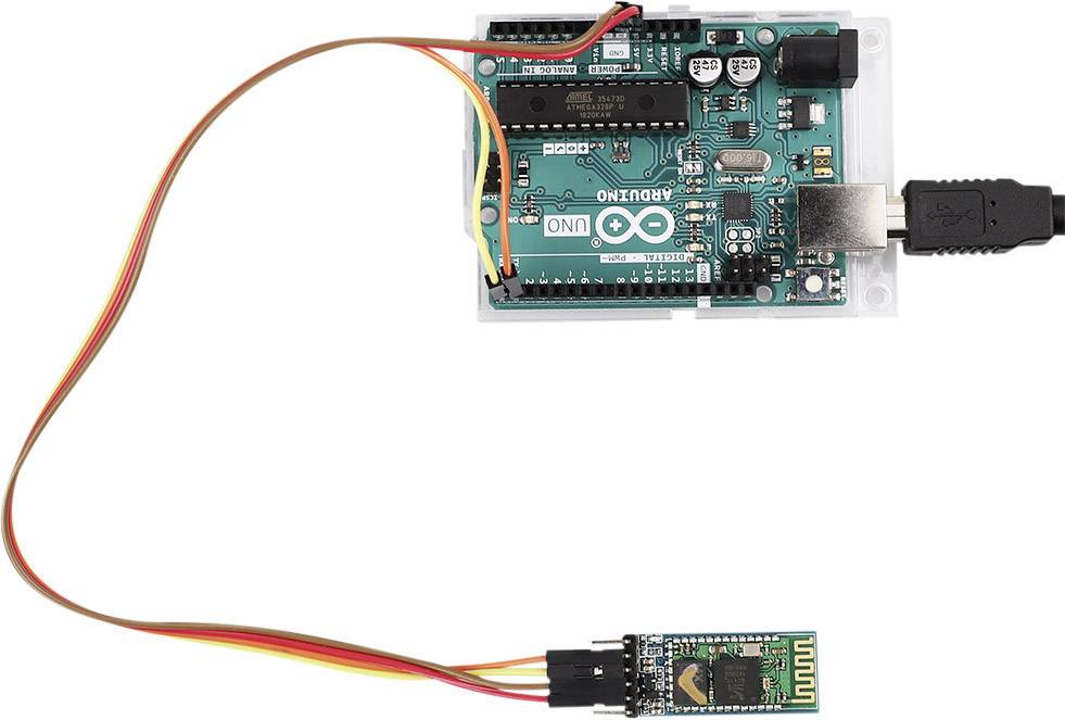 Arduino UNO board with a Bluetooth module connected via wires, enabling wireless communication for projects.