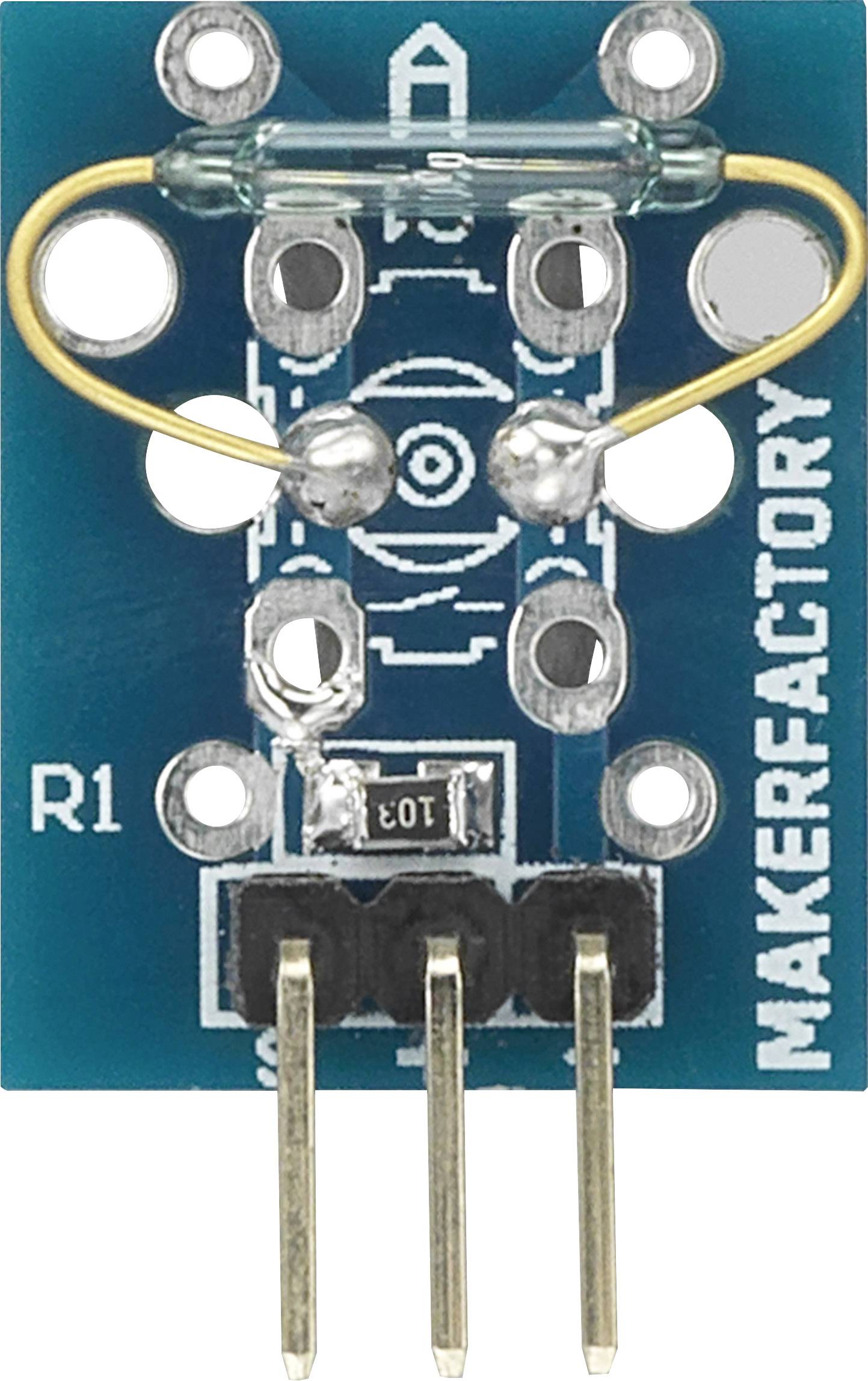 An electrical component with a fuse and multiple connections on a blue circuit board, labelled 'MAKERFACTORY'.