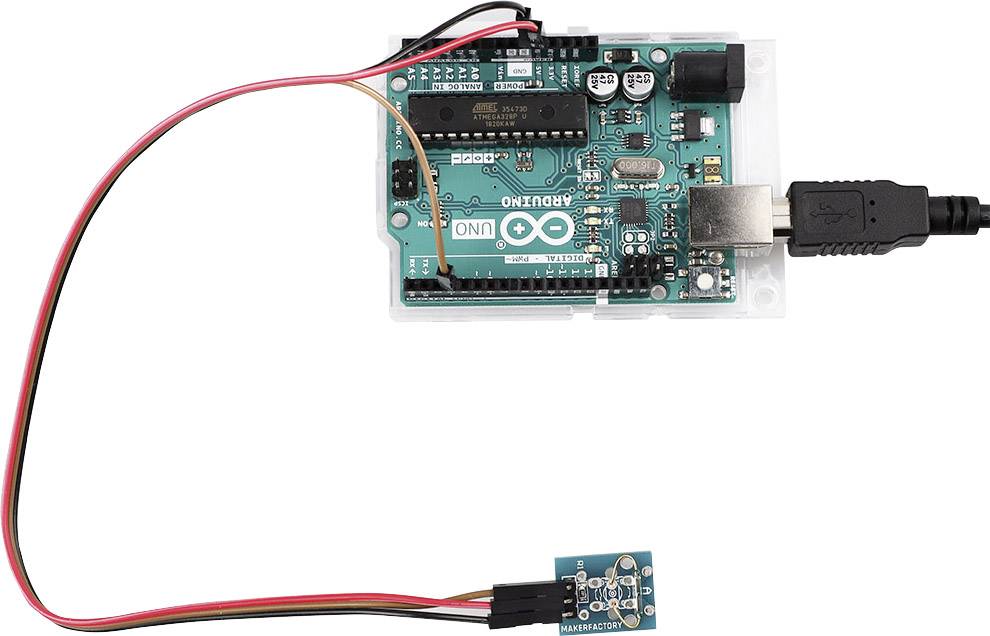 Image of an Arduino UNO board with a sensor connected via cables. USB cable connected to a computer.