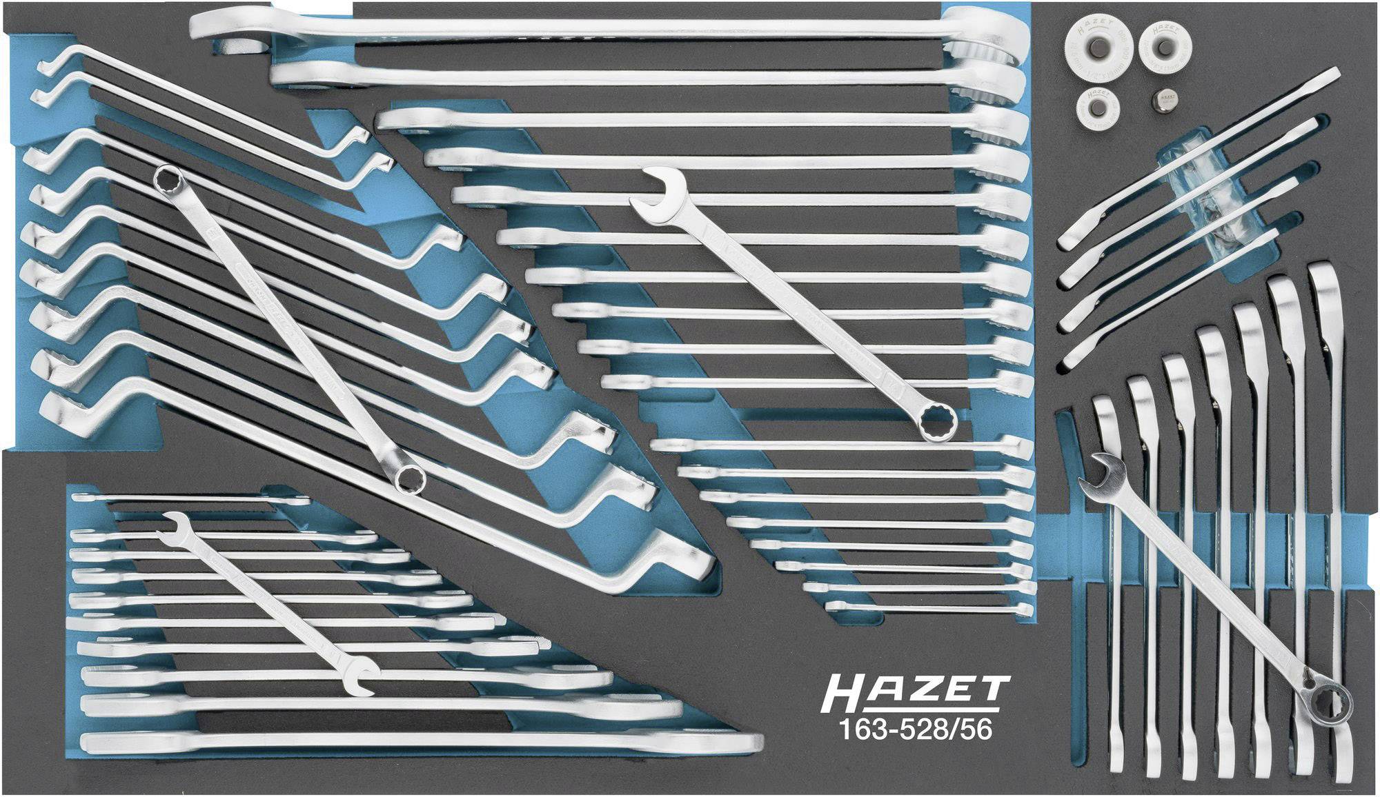 Set of open ring spanners and shifting spanners on a tool mat. Brand name and model number bottom right.