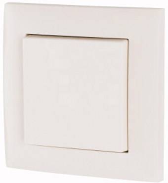 A single white light switch on a wall, photographed from a slightly angled perspective. The switch is square with rounded edges.