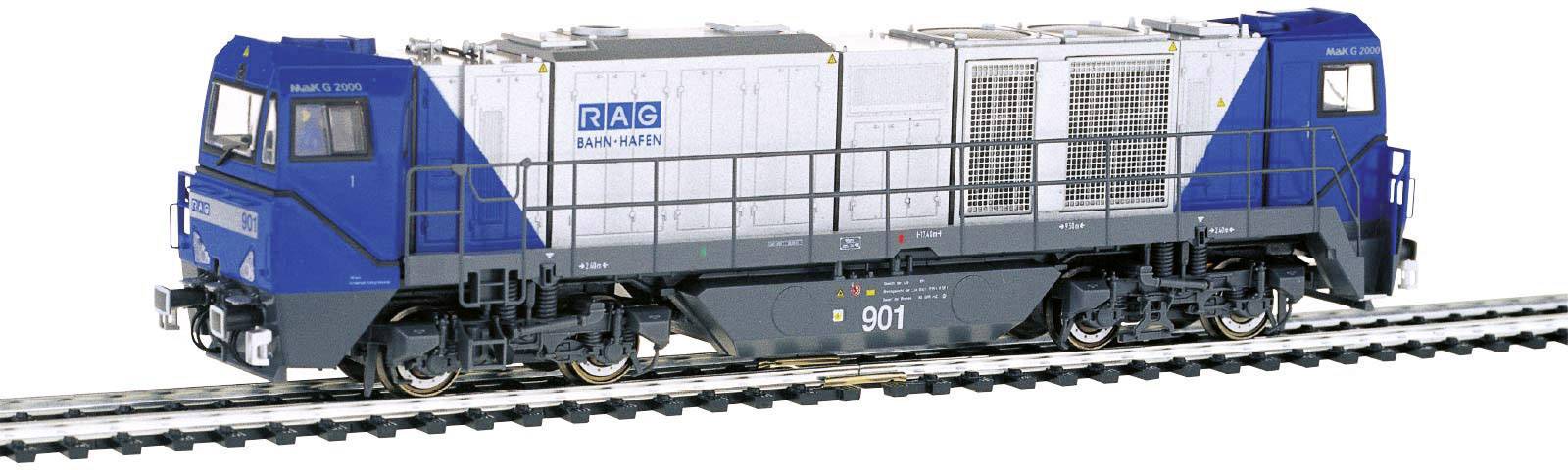 A blue and white model train with the inscription 'RAG Bahn und Hafen'. The train is positioned on railway tracks and displays technical details.