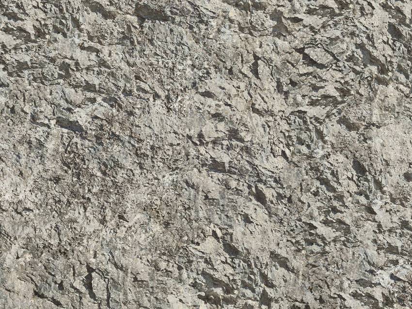 Rough grey stone wall with irregular texture; detailed surface.