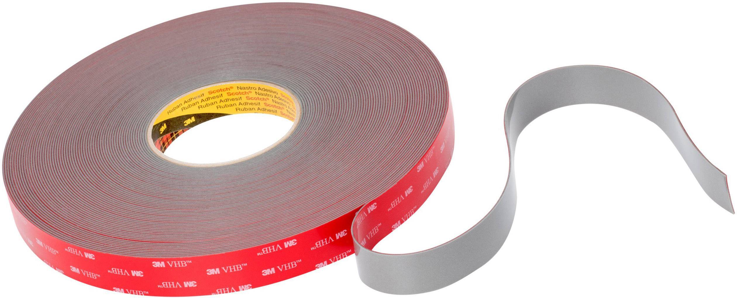 A roll of double-sided, red 3M adhesive tape, partially unrolled. Ideal for strong adhesion on smooth surfaces.
