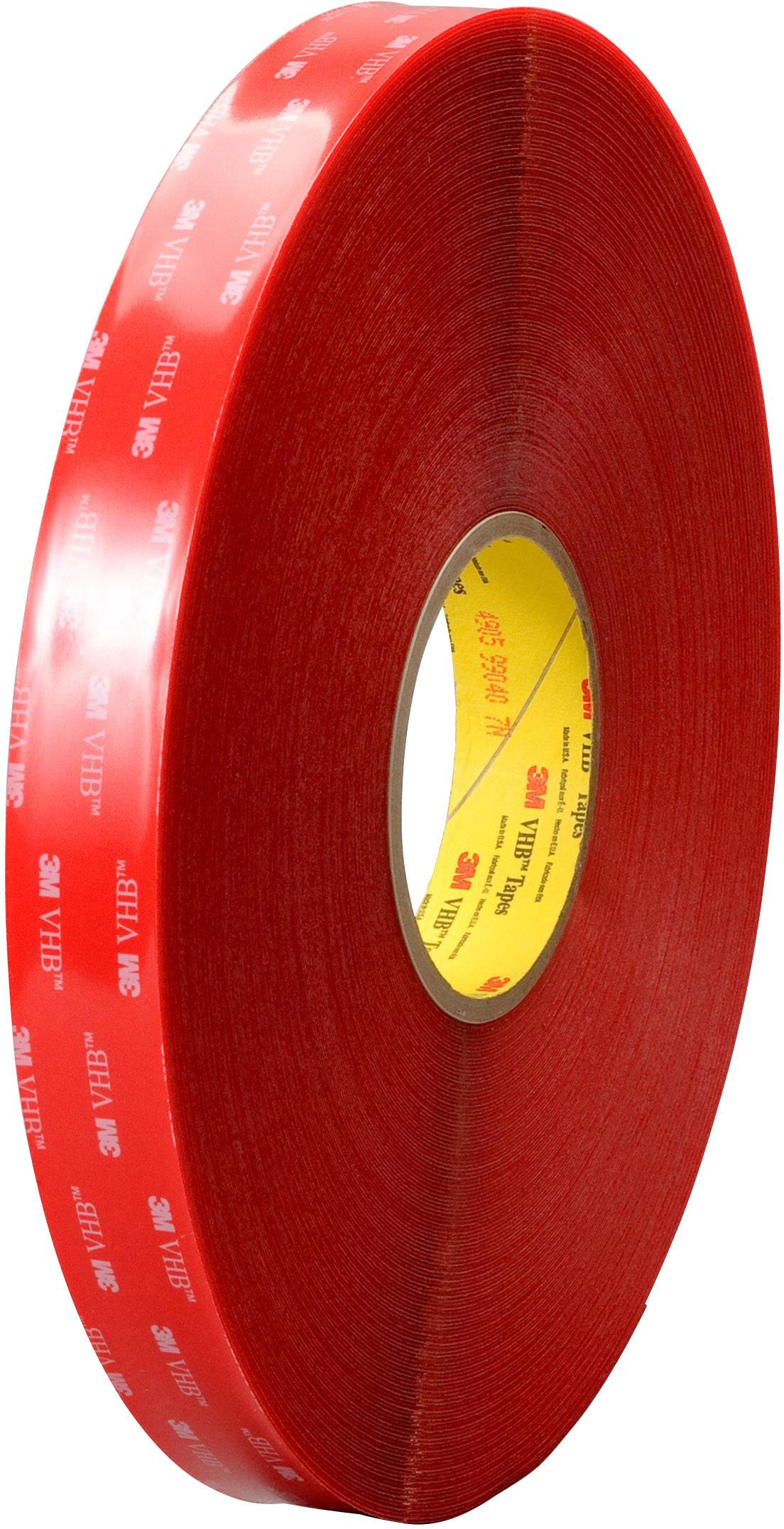 Red roll of double-sided adhesive tape by 3M VHB, standing upright. The tape has a glossy surface.