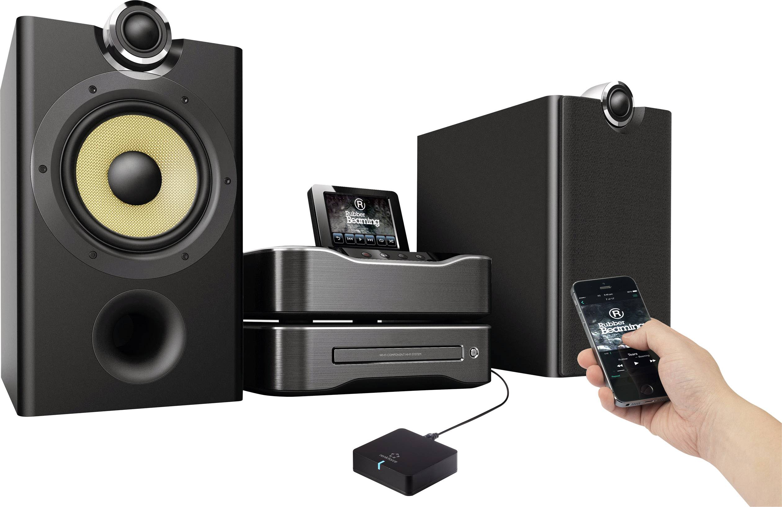 A sound system with two speakers, a central control unit, and a person controlling it with a smartphone.
