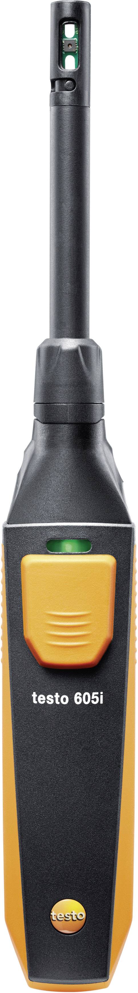 A digital thermo-hygrometer with a black and orange casing displays humidity and temperature readings.