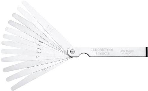 Feeler gauge with 13 blades in varying thicknesses, fanned out, for measuring gaps and tolerances.