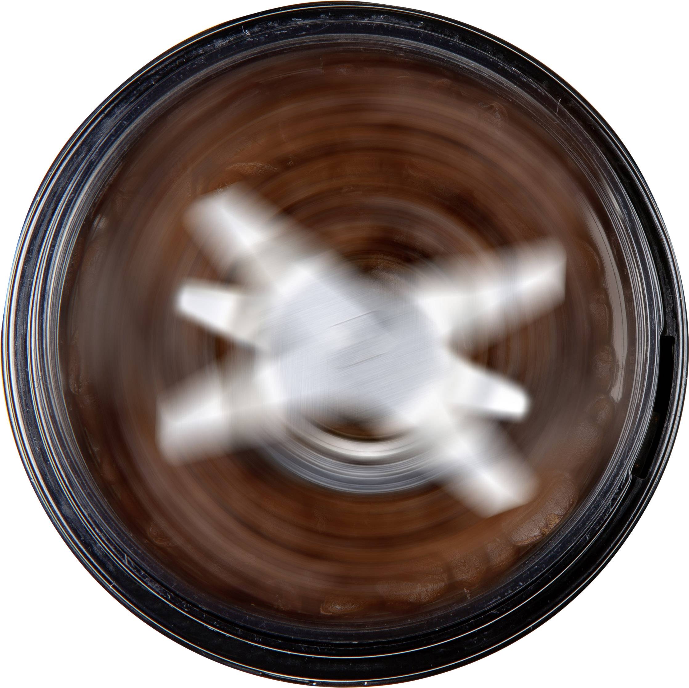 A food processor mixing chocolate. The four blades spin rapidly and blend the mixture evenly.