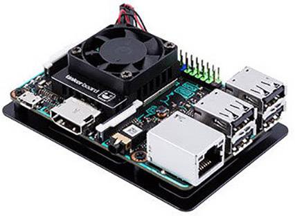 A single-board computer with a fan on the top side, multiple USB ports, HDMI output and Ethernet port, on a black board.