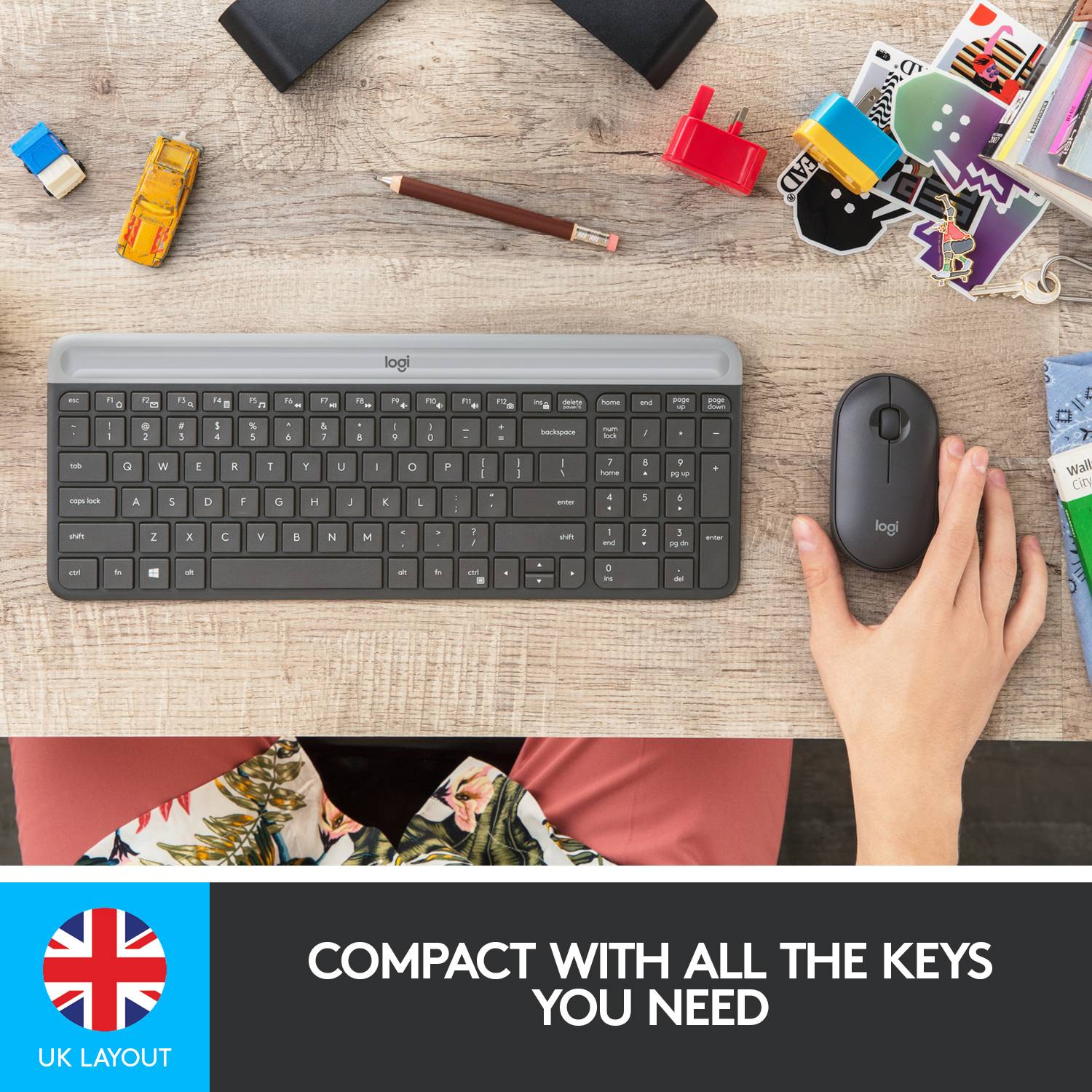 Keyboard and mouse on a desk, surrounded by office supplies. Text below: 'Compact with all necessary keys'.