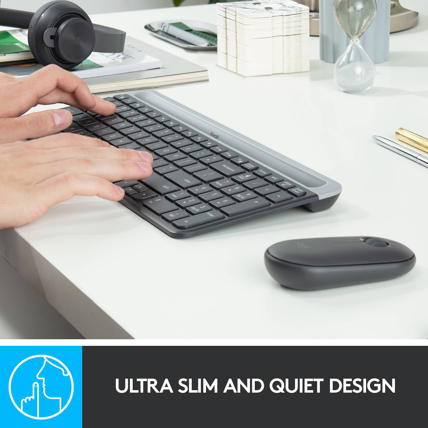 A hand taps on a slim, flat keyboard. A computer mouse lies beside it. At the bottom right, it reads 'ULTRA-THIN AND QUIET'.