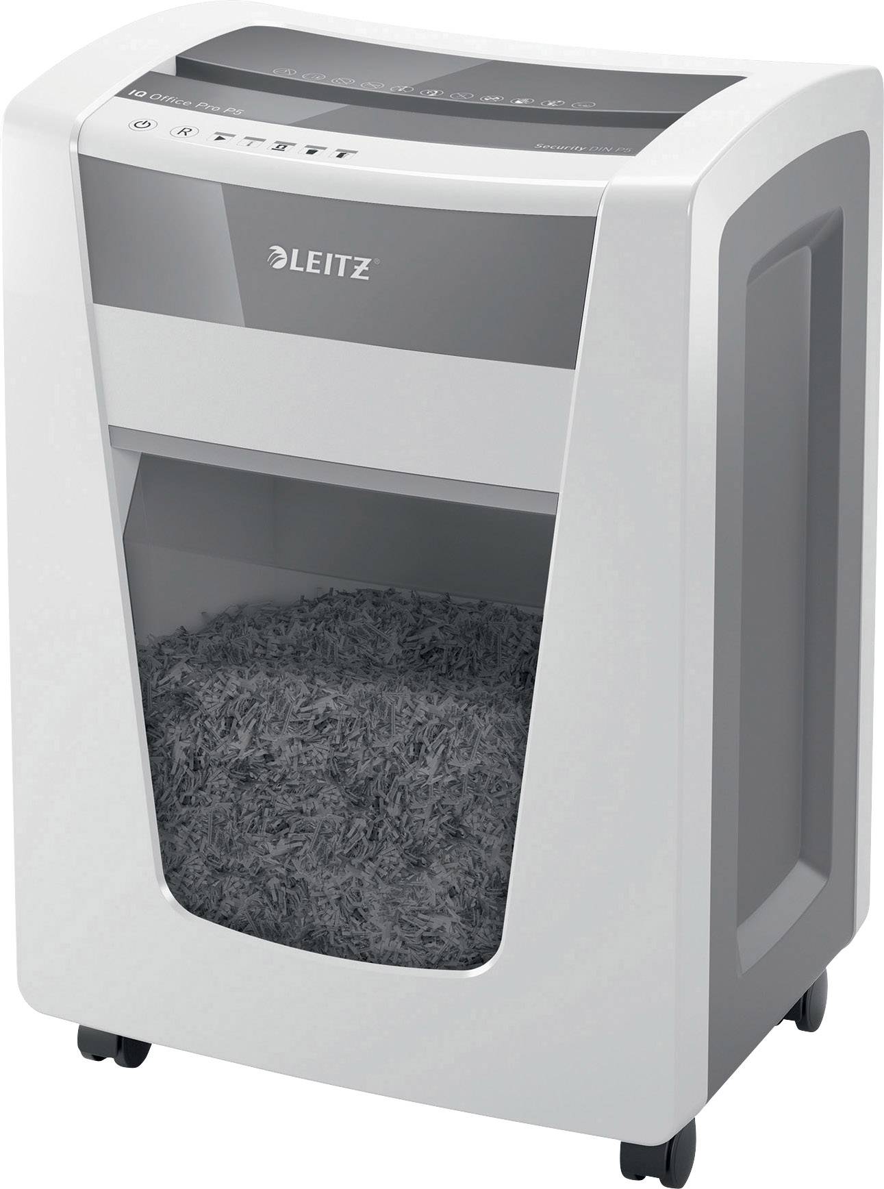 An office paper shredder with a silver casing on wheels, half-filled with shredded paper in the transparent collection bin.