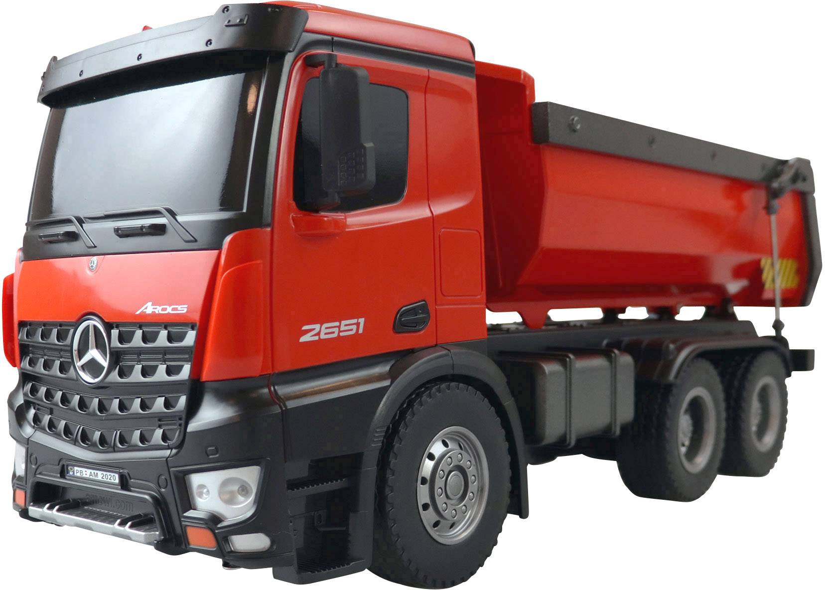 Red toy truck model representing a tipper lorry. The front view shows details such as headlamps and vehicle markings.
