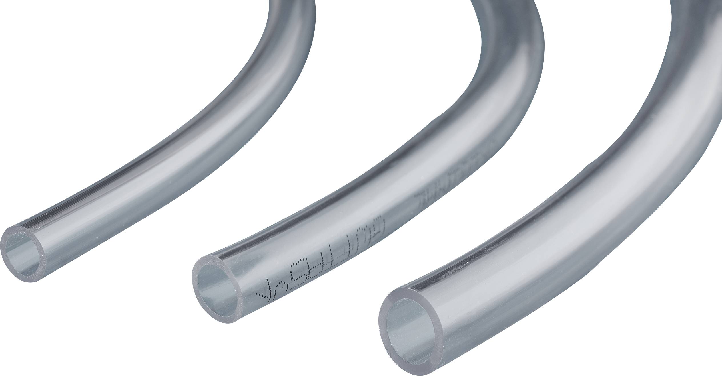 Three transparent tubes lying side by side demonstrate flexibility and material strength.