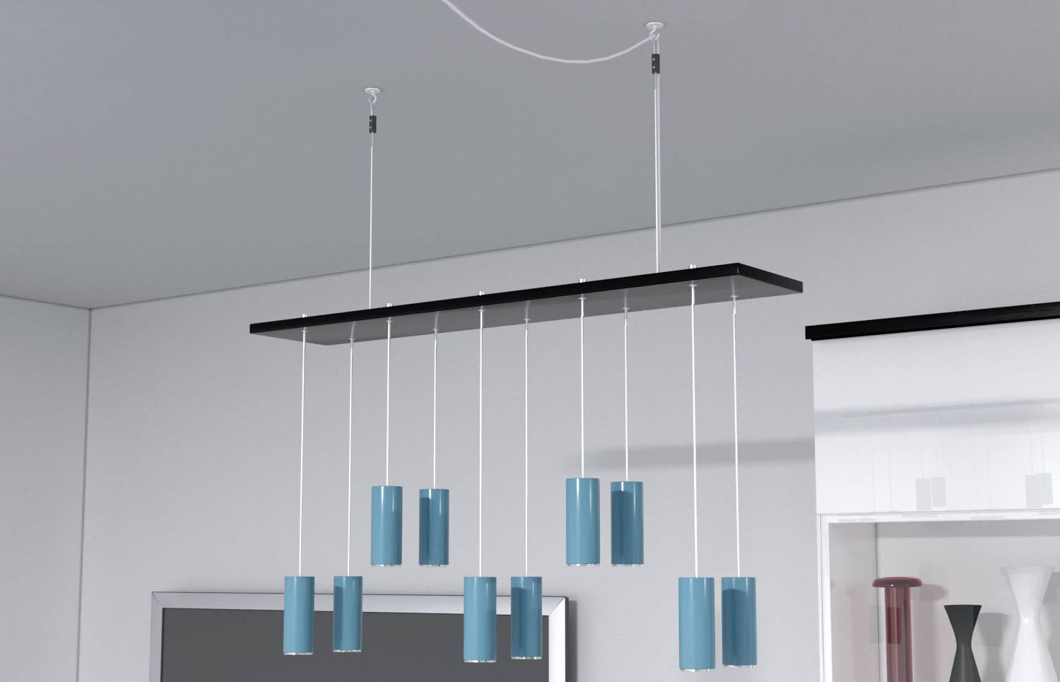 Modern hanging lamp with blue, cylindrical lampshades hanging from a rectangular ceiling mount.