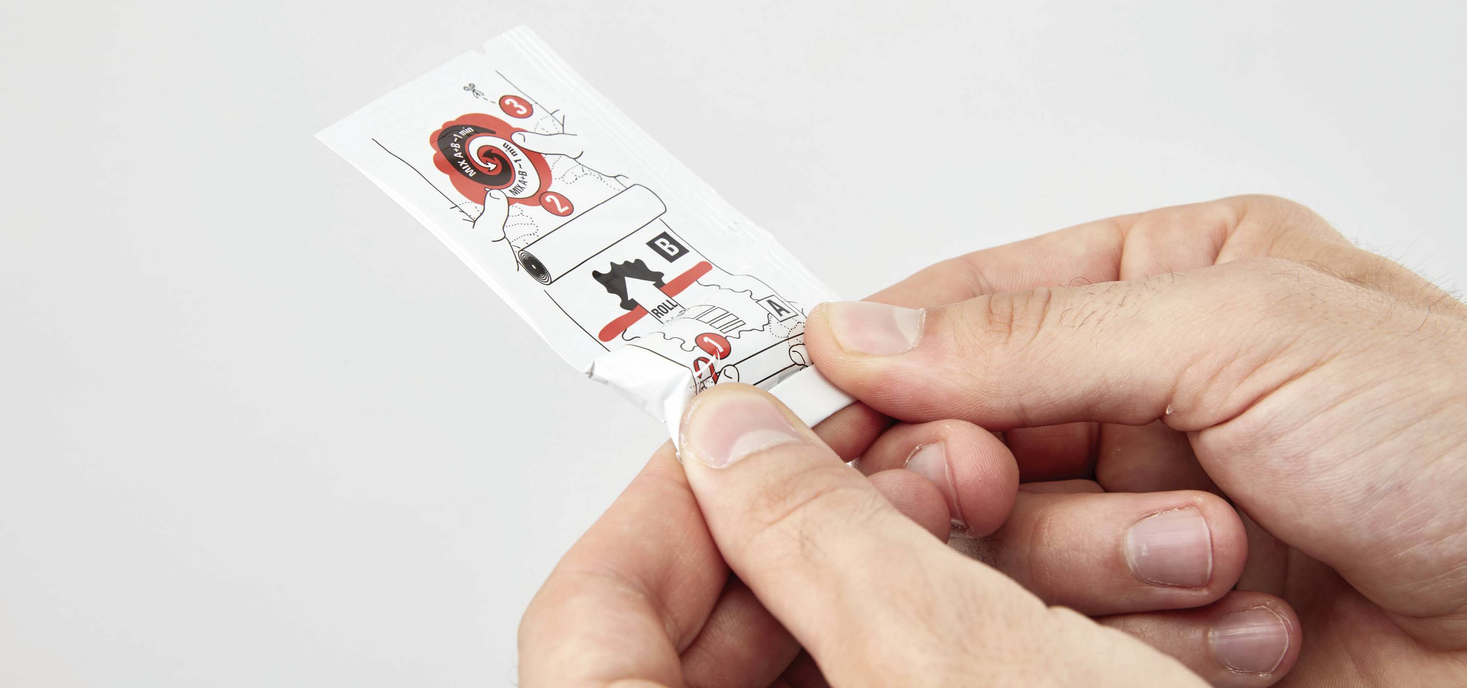 A hand opens a package with instructions for use. Simple illustrations show various steps.