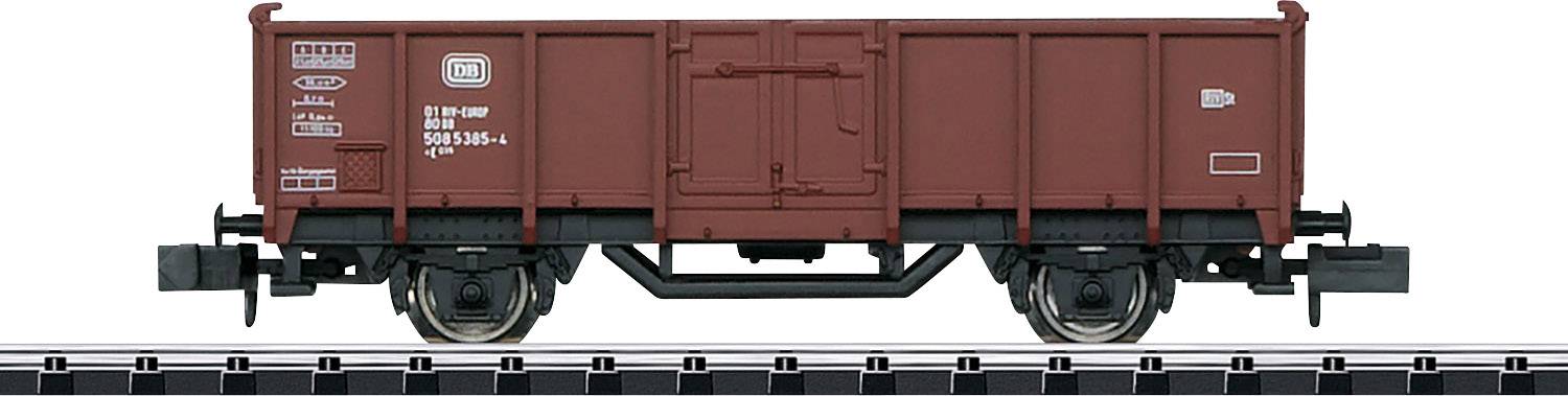 A brown goods wagon on rails, side view. Wagon has markings and details, suitable for model railway layouts.