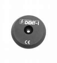 A black plastic cap with a small hole in the middle and the inscription 'FRICTION DECK DENT-I'.