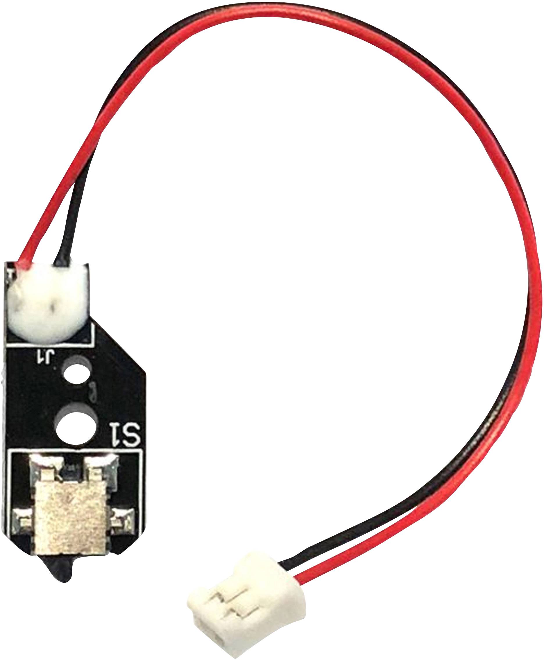A small black switch on a circuit board with red and black wires, attached to a white connector.