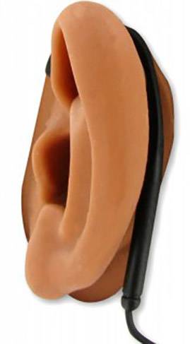 A large model of a human ear with a black stethoscope on the back to illustrate hearing tests.