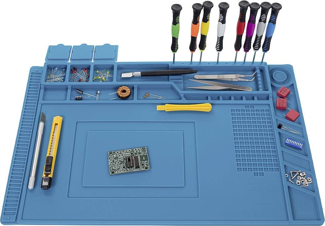 Blue work mat set with various tools such as screwdrivers, pliers and utility knife. Components and electronic circuit board present.