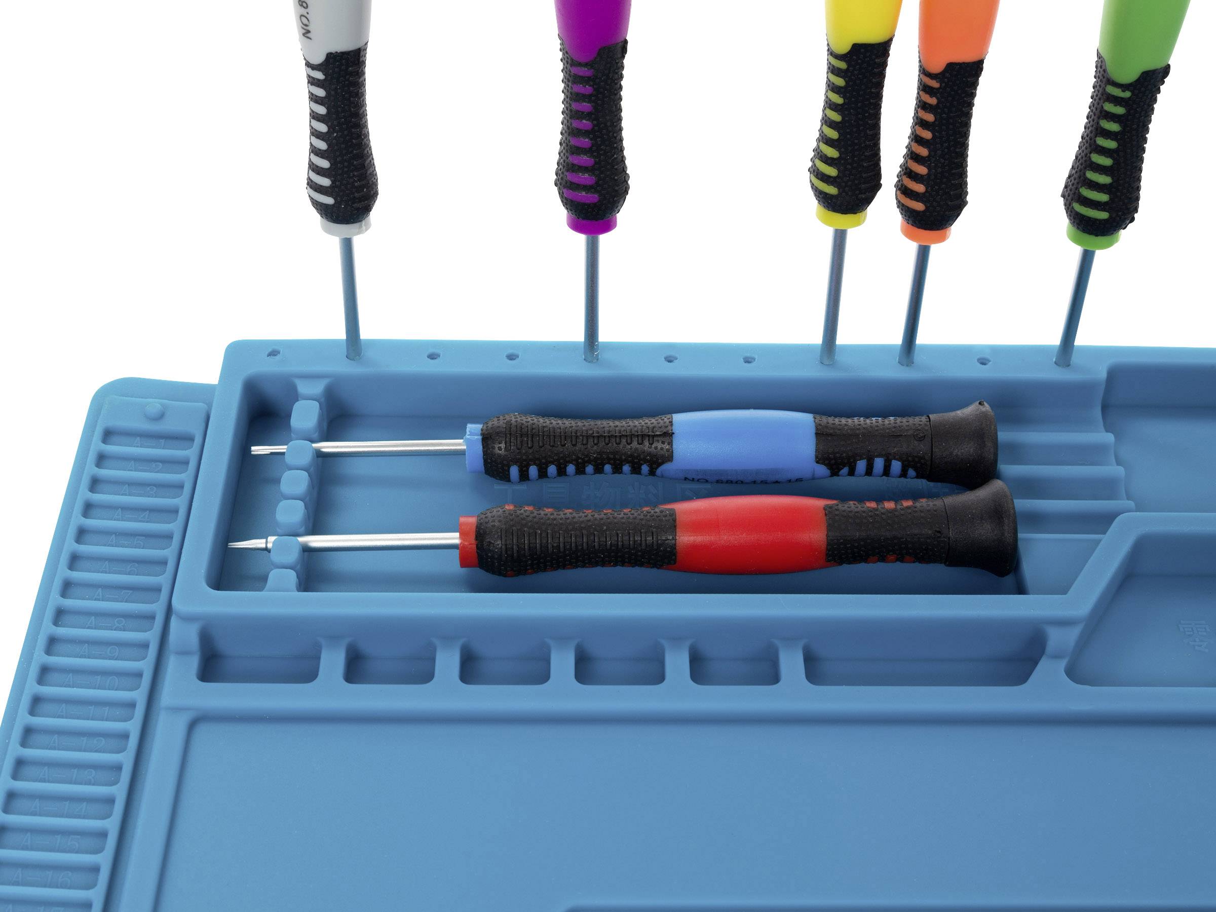 Various colourful screwdrivers in a blue tool holder. Two screwdrivers are lying horizontally, others are standing vertically.