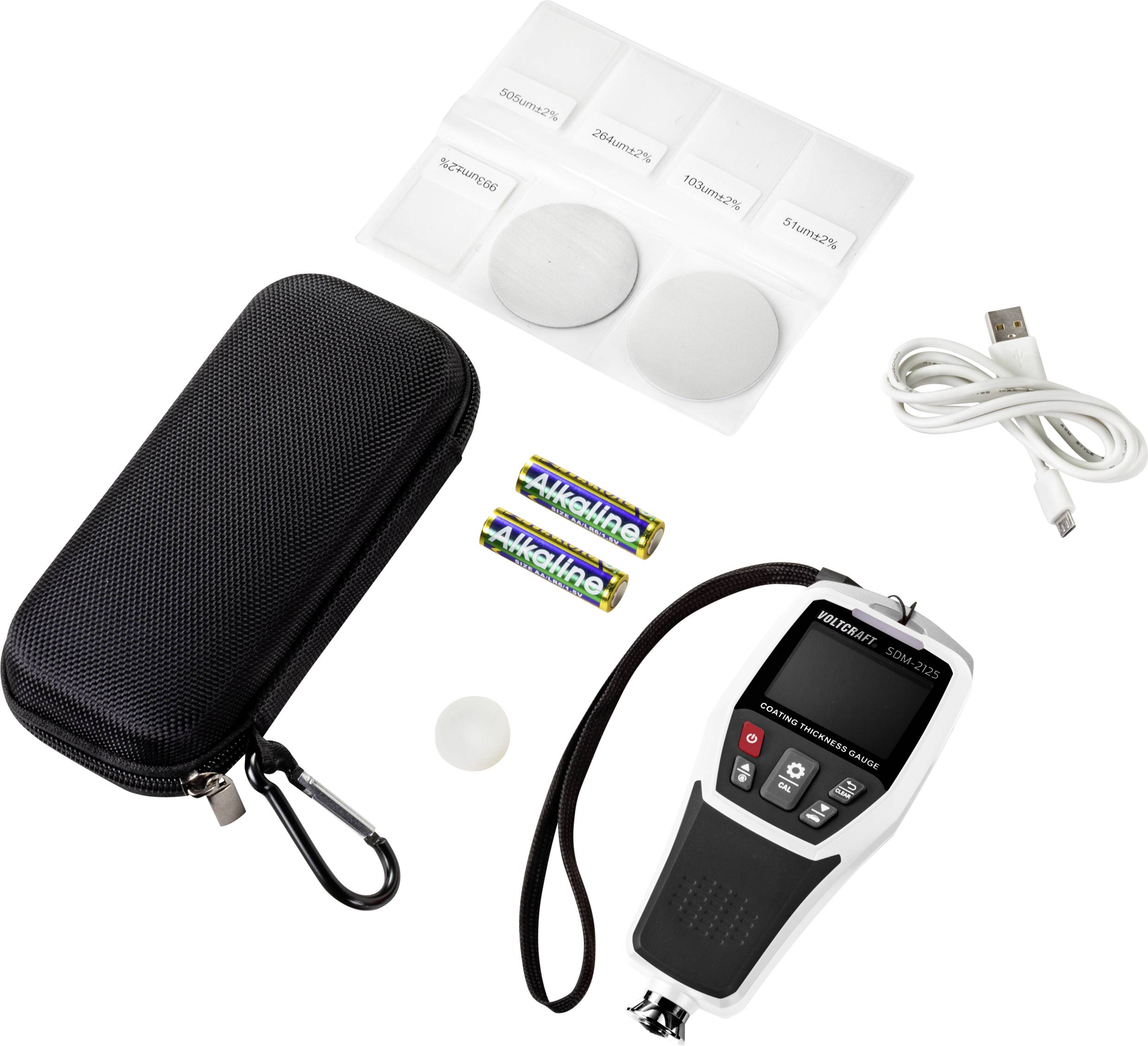 A digital light metre with accessories: hard-shell case, four calibration discs, USB cable and two AAA batteries.