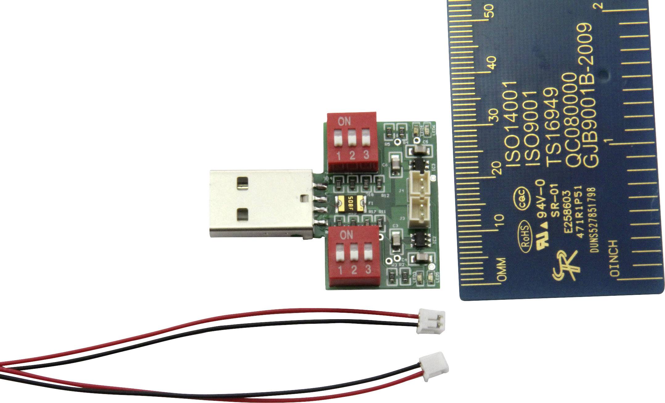 USB module with toggle switches, positioned next to a measuring ruler for size comparison. Two separate cables with connectors at the bottom.