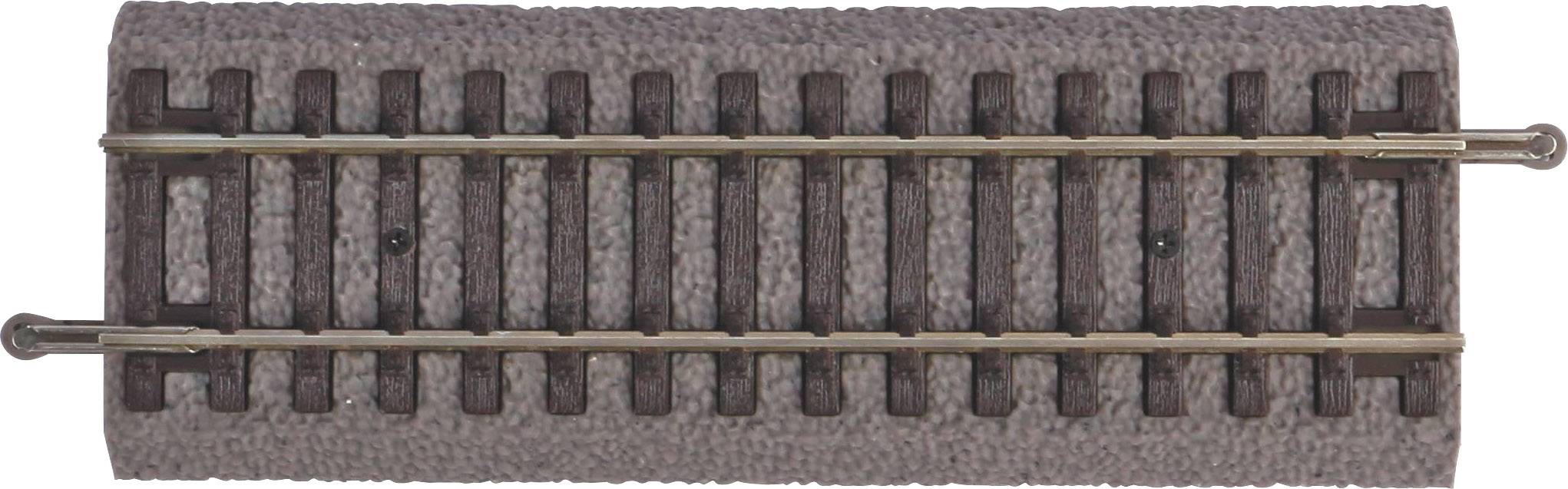 A piece of model railway track with two metal rails on a brown, textured surface, suitable for scale model trains.
