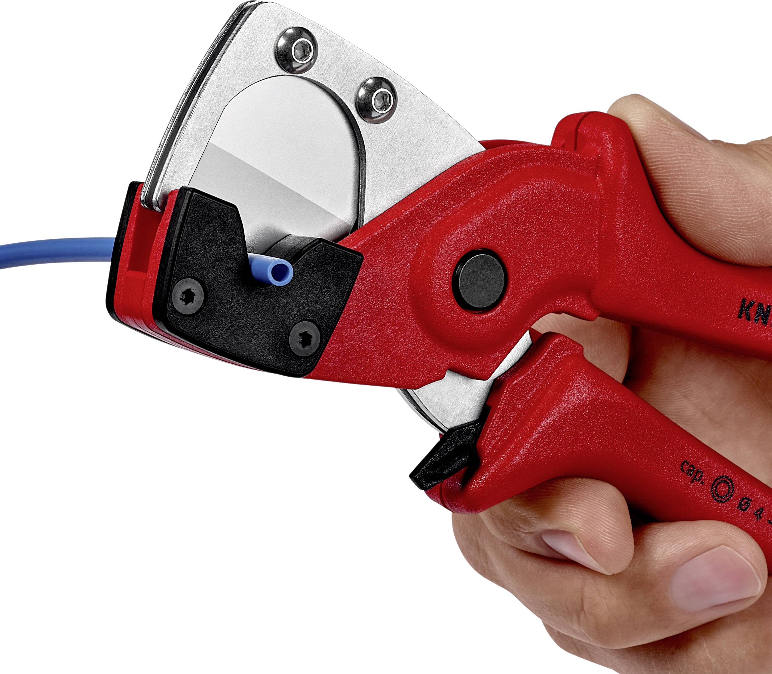 A hand is holding a red cable cutter that is cutting a blue cable. The pliers have metallic and black details.