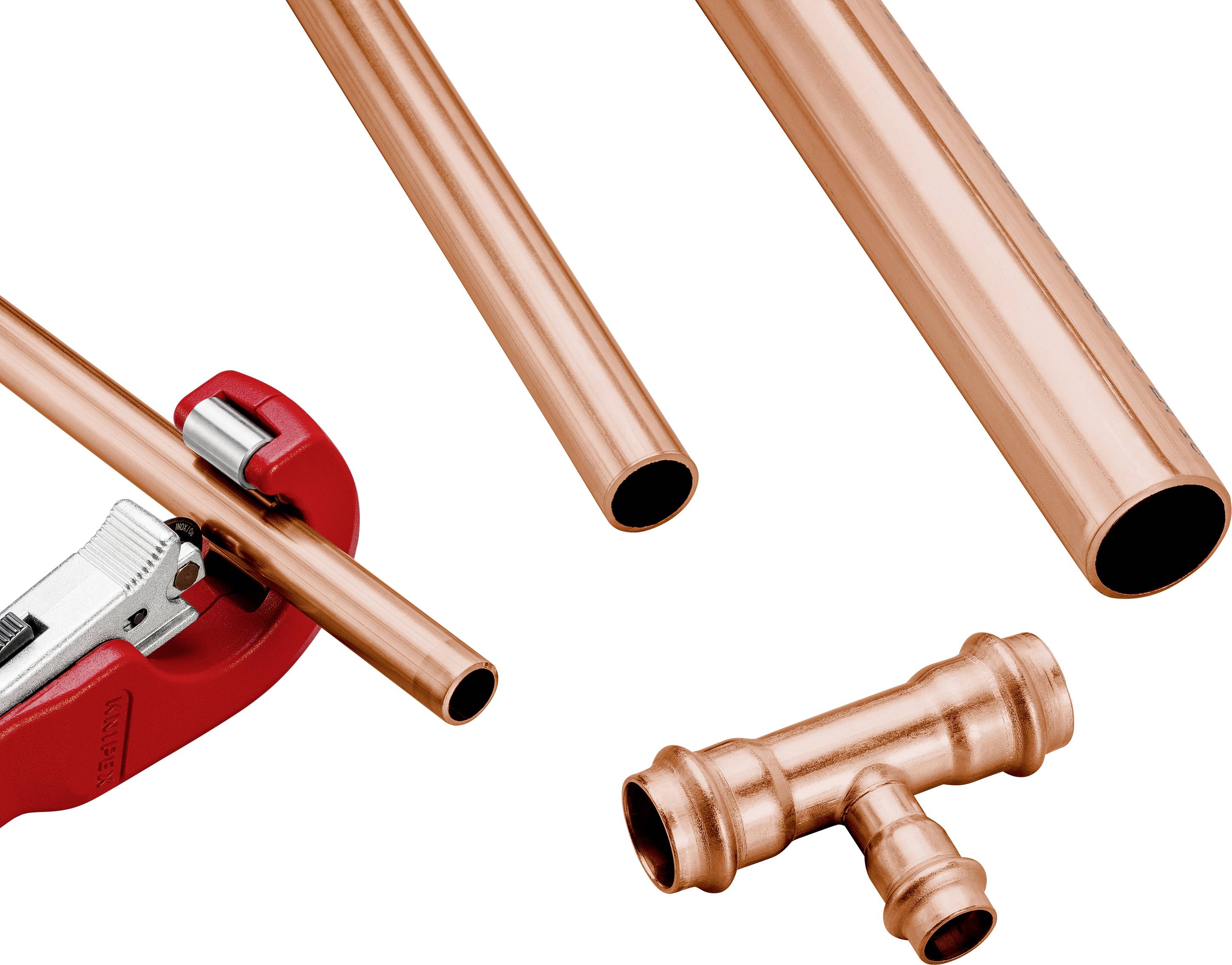 Copper pipes and a pipe cutter next to a T-shaped pipe connector, shown against a white background.
