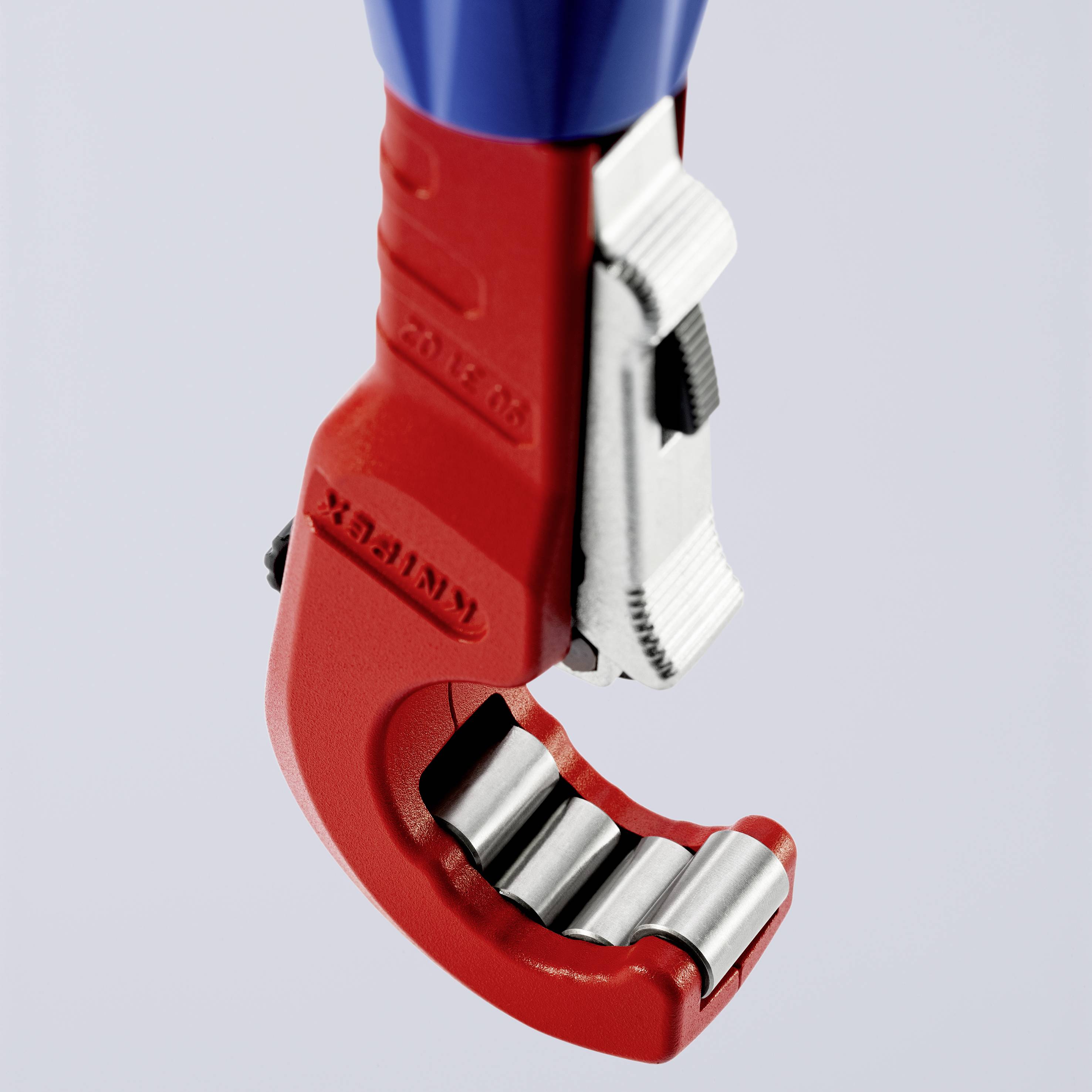 A red pipe cutting tool with a blue handle and silver cutting blades, suitable for copper pipes.