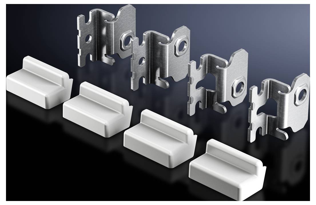 Metal clips and white plastic brackets, arranged on a black background.