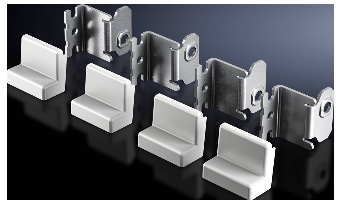 Five white plastic clips next to five metal snap fasteners on a dark surface, arranged from left to right.