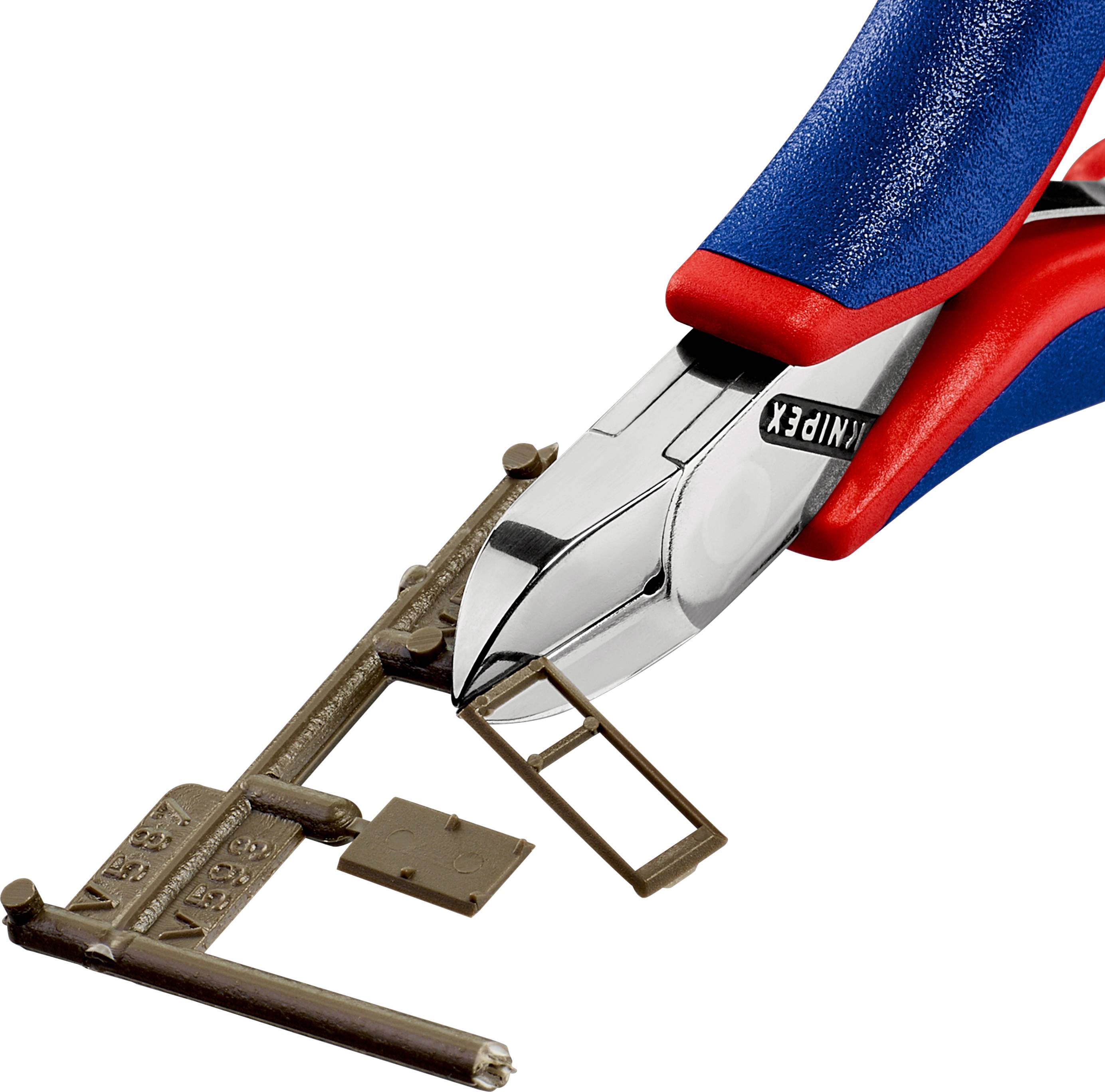 Pliers cutting a metal tag from a key blank on a white background.