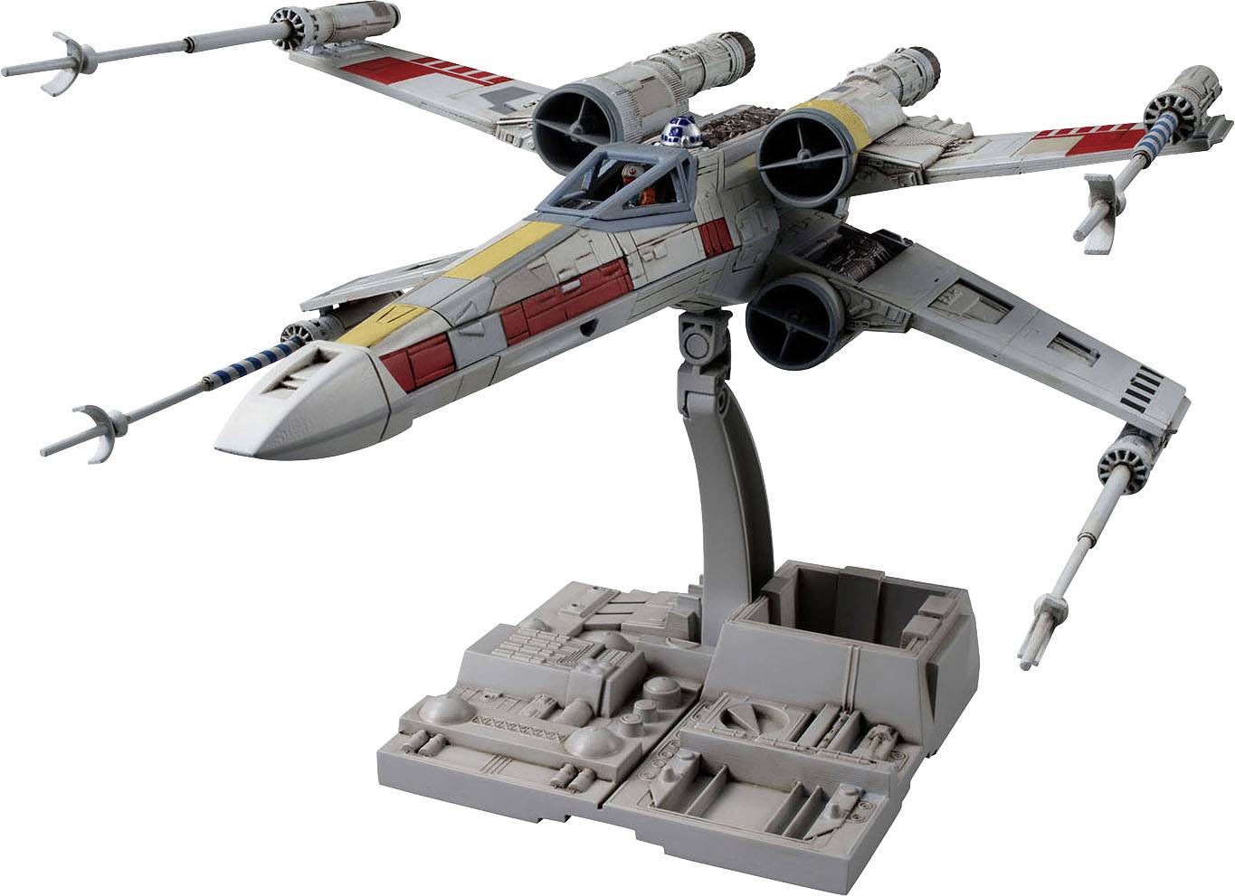 A model of a futuristic spacecraft with four wings in an X-formation on a stand. It has red and yellow markings.