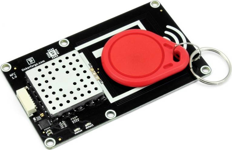 A PCB with a red RFID tag on it. The board has connectors and displays an NFC (Near Field Communication) logo.