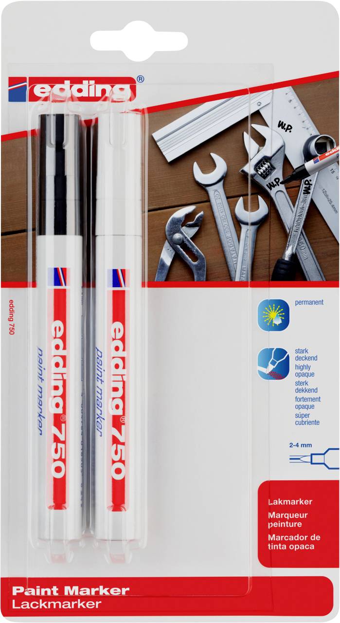Two Edding 750 paint markers in Black and White in one package. Alongside the markers are tools such as spanners.