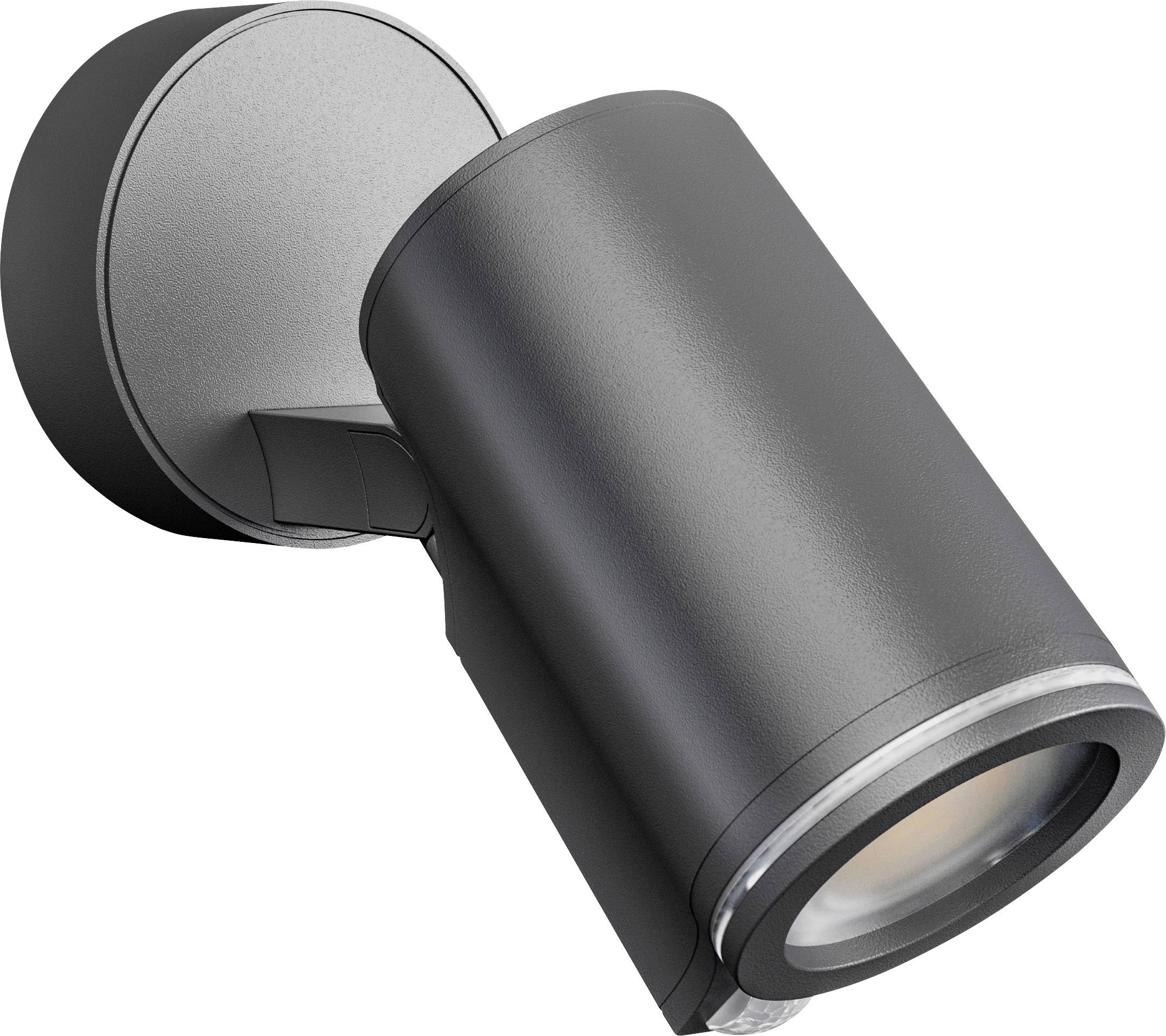 Black outdoor wall light with cylindrical housing mounted on a wall bracket, casting light downwards. Modern design for directional illumination.