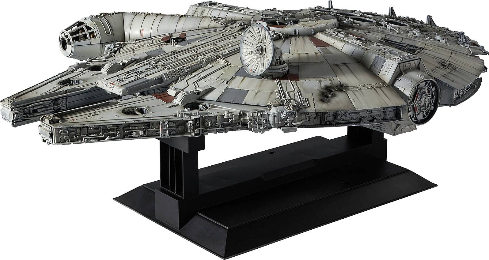 A model of the Millennium Falcon from 'Star Wars', displayed on a black stand. It showcases numerous details of the spacecraft.