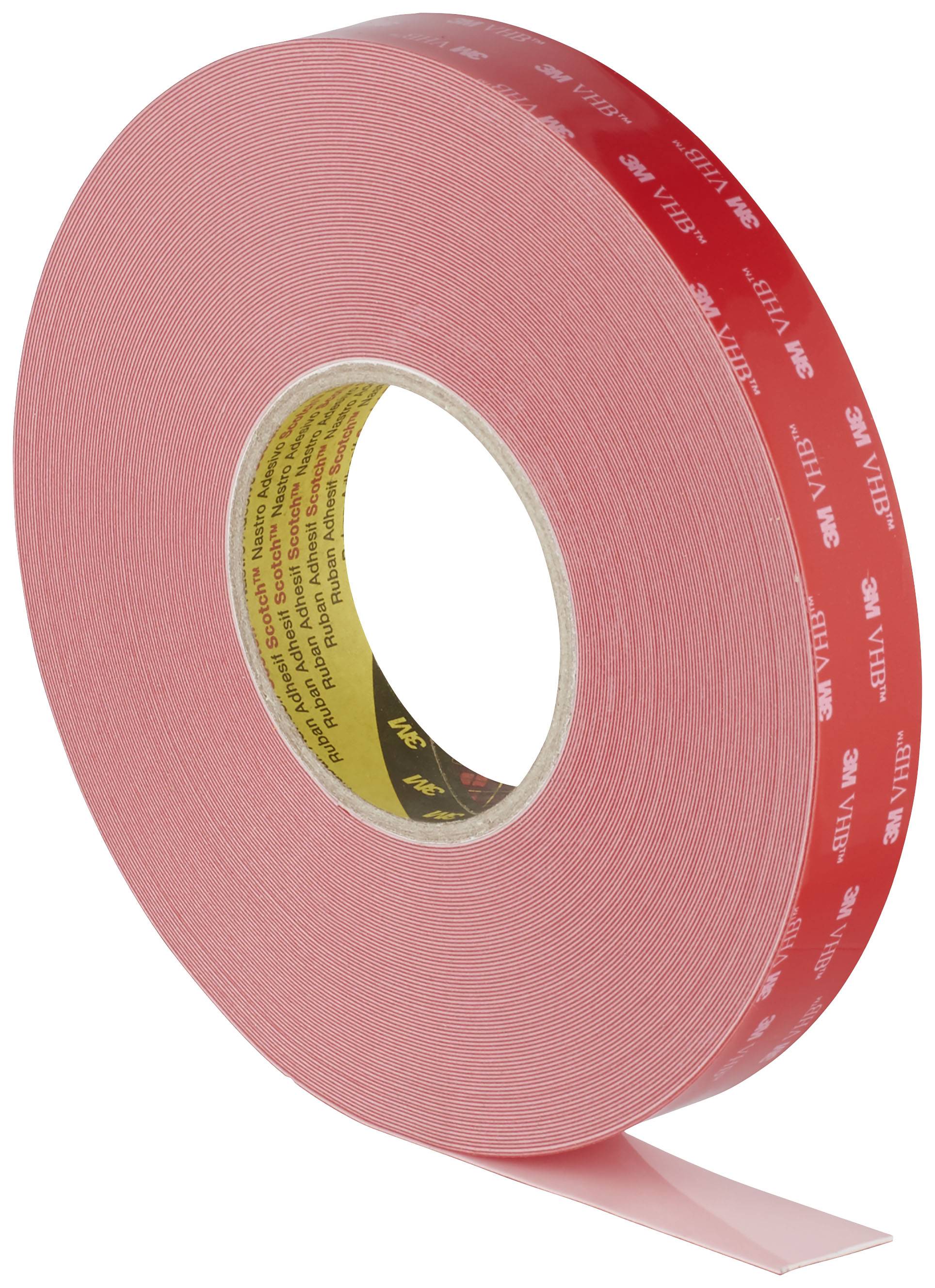 Red roll of double-sided adhesive tape, partially unrolled. The tape is labelled '3M VHB'.