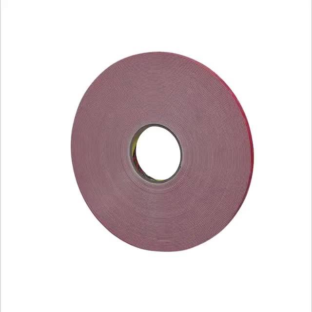 A large roll of red adhesive tape on a light background.