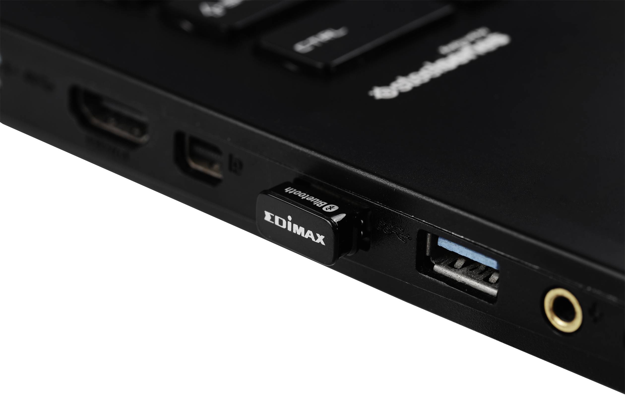 A black USB Wi-Fi adapter from Edimax is plugged into a laptop's USB port. Next to it are HDMI and audio sockets.
