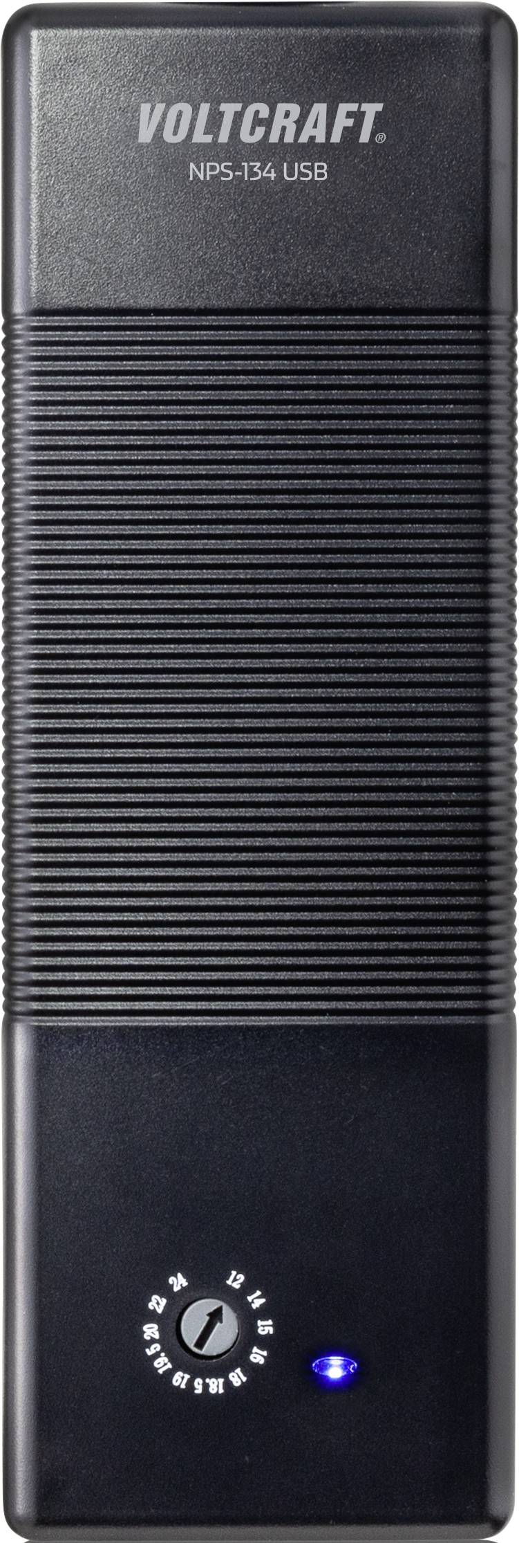 Black, rectangular device with the print 'Voltcraft NPS-134 USB'. Beneath it, a blue indicator light and a control dial with symbols.