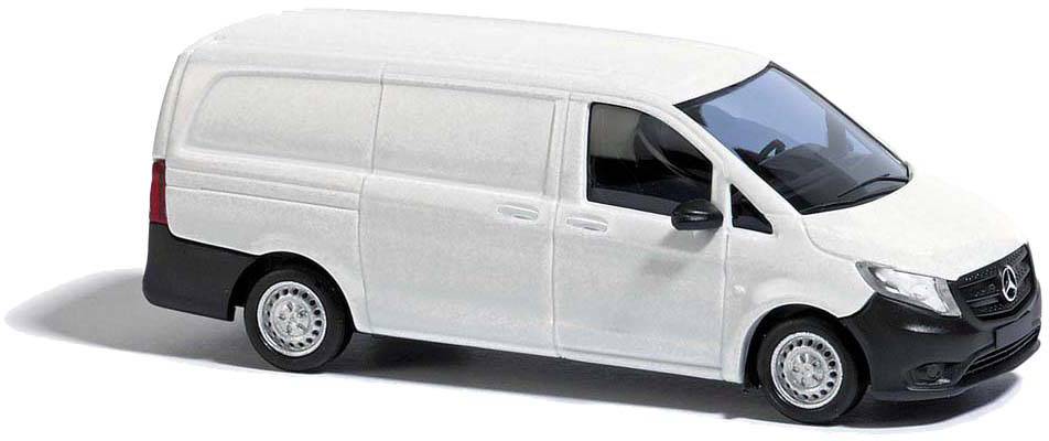 White delivery van, side view, with Mercedes-Benz emblem on the grille. Vehicle stationary on neutral background.