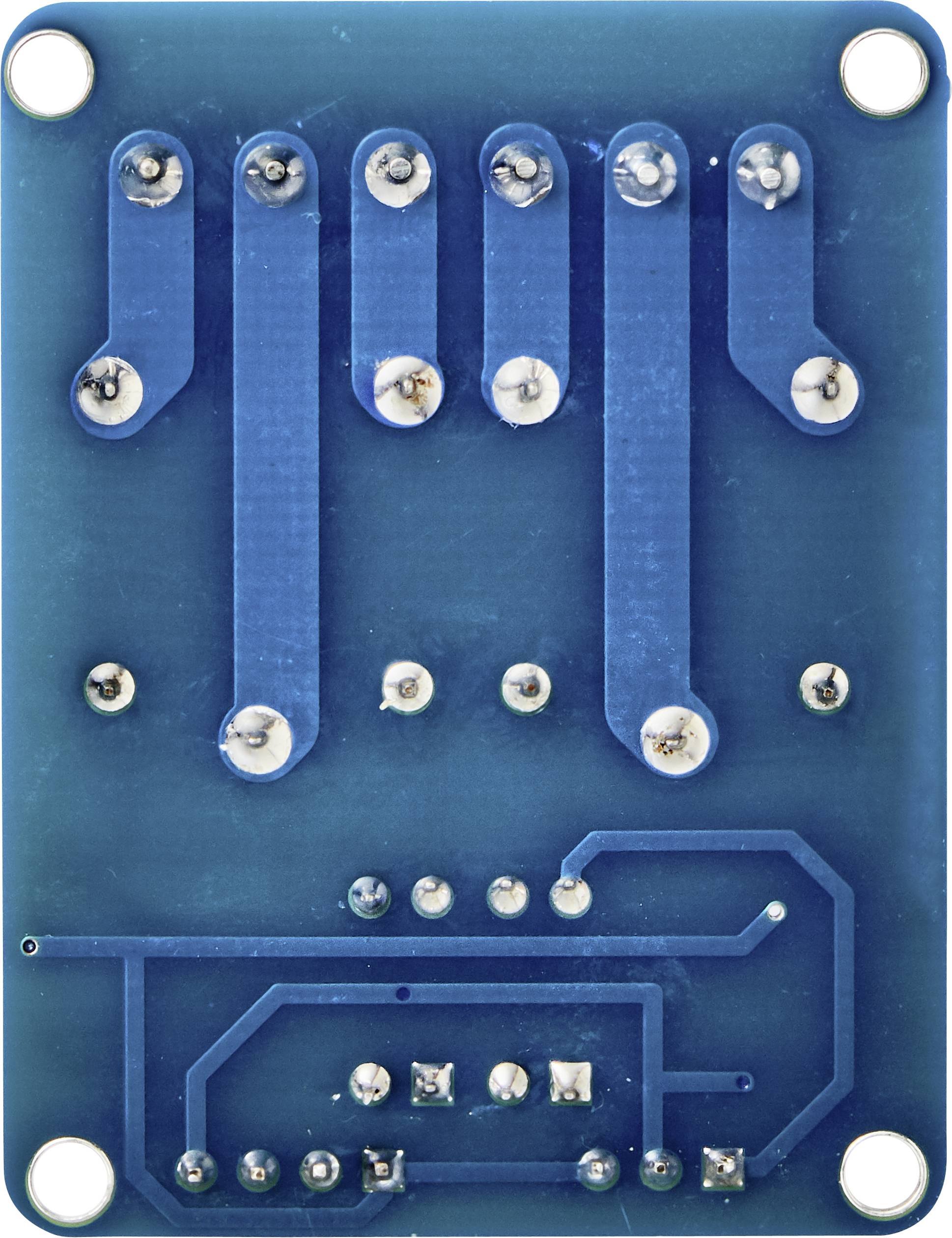 Blue printed circuit board module with multiple soldered metal connections and traces. Shows the reverse side of an electronic component.